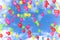 Colorful balloons flying in the blue sky with white clouds, color red, yellow,green,pink,blue, party festive holiday event, birthd