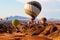 Colorful balloons flying over the moon valley mountain. Africa. Namibia