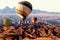 Colorful balloons flying over the moon valley mountain. Africa. Namibia