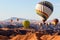 Colorful balloons flying over the moon valley mountain. Africa. Namibia