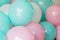 Colorful balloons pastel colors closeup. Birthday or party mockup for planning. Festive greeting card. Holiday concept. pink, mint