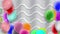 Colorful balloons swaying with the wind. The background is streaked with white fluffy fabric arranged in full space.