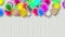 Colorful balloons swaying in the wind on a gray background.