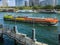 Colorful barge passes 13th arrondissement on the Seine River, Paris, France