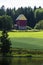 Colorful barn at the shore of lake