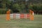 Colorful barriers on the ground for jumping horses and riders at riding school as a background.Obstacles for horses in a riding