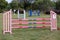 Colorful barriers on the ground for jumping horses and riders at riding school as a background.Obstacles for horses in a riding