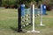 Colorful barriers on the ground for jumping horses and riders at riding school as a background.Obstacles for horses in a riding