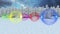 Colorful baubles decorations against snow falling over winter landscape against night sky