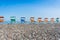 Colorful beach chairs on the shingle beach