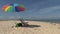 Colorful beach chairs and umbrella on beach