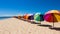 Colorful beach huts and sun umbrellas on vibrant seaside boardwalk for summer fashion promotion