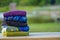 Colorful beach towels stacked on a recreation table at a resort