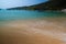 Colorful beach with water and mountain waves