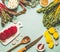 Colorful beetroot cooking preparation. Red and yellow sliced beetroot, chard leaves and ingredients on light blue kitchen table