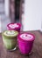 Colorful Beetroot, matcha lattes are on the wooden background