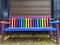 Colorful bench with different shiny colors as symbol for variety and diversity and Pride concept for tolerance beautiful garden