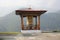 Colorful Bhutanese Prayer Wheel in Mountain Setting