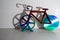 colorful bicycle and visible shadow, creative effect of sunlight, reflection on the wall, mirroring volume