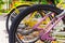 Colorful bicycles stand in row on a parking lot