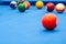 Colorful billiard balls on blue table, billiards game