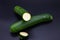 Colorful bio fresh green zucchini on black background