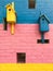 Colorful birdhouses on a multi-colored brick wall. summer. spring