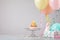 Colorful Birthday Cupcake with Balloons and party hats