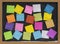 Colorful blank notes on blackboard