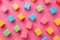 Colorful blocks on pink background in a creative and playful pattern