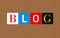 Colorful Blog letters over brown stripped background. Vintage style.