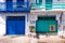 Colorful blue and green garage doors in greek Klima fishermen village - the most colorful village in Greece