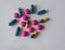 colorful blue green yellow and pink pills pain killers and antibiotic capsule