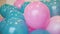 Colorful blue and pink balloons woven together