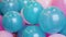 Colorful blue and pink balloons woven together