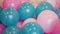 Colorful blue and pink balloons woven together