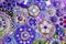 Colorful of blue, purple or violet wall decorated with multicolor stone, gravel and gem for background