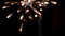 Colorful blurred firework lights on black sky background. Stock footage. Concept of New Year and Christmas, rear view of