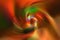 Colorful blurred gradient spiral vortex background. Orange, green, yellow, red mixed multicolor texture