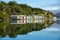 Colorful Boat Sheds with beautiful reflection on daytime  at Duvauchelle, Akaroa Harbour on Banks Peninsula in South Island, New