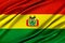 Colorful Bolivia flag waving in the wind.