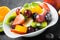 Colorful bowl of healthy tropical fruit salad