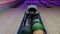 Colorful bowling balls in a close up returning to the players area