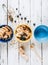 Colorful bowls with morning health meal: homemeade granola with