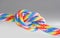 Colorful braided cords tied together isolated