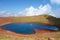 Colorful and breathtaking view at the top of Azhdahak volcano with a turquoise lake hidden inside in Geghama mountains, Armenia