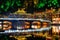 Colorful bridge reflected in water at night, Fenghuang