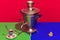 Colorful bright image of old-fashioned kettle called samovar isolated over red background