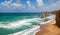 Colorful bright panorama of the vast ocean, turquoise large waves and free-standing rocks in the sea near the coastal cliffs and