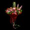 Colorful bright unique bouquet of flowers and fruits isolated on black background